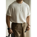 Casual pullover top with raglan sleeves in terry texture fabric showing loose fit and colour options