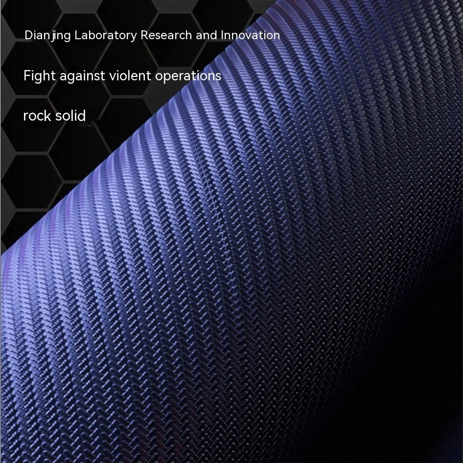 Large black gaming mouse pad with mech-style graphics on a desk, showing its non-slip rubber base and TYPC interface.