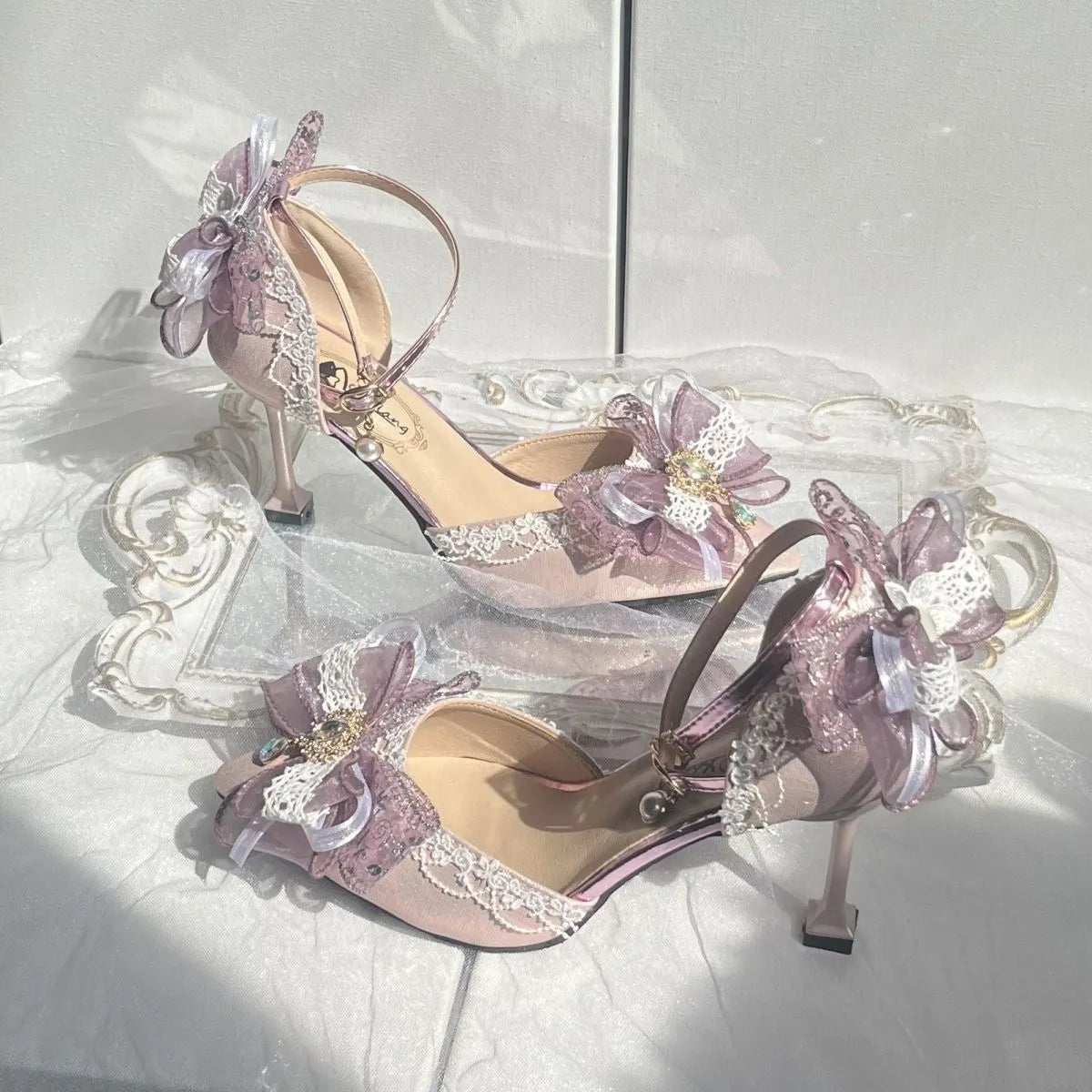Purple satin women's wedding shoes with square toe and stiletto heel on white background