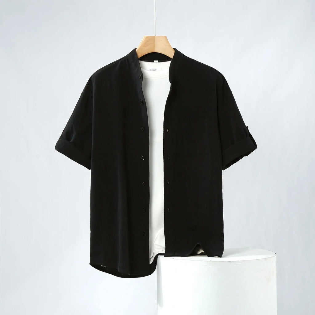 Men's loose fit linen short-sleeve shirt in a solid colour with a simple stand collar.