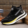 Low-top black safety work boot with lace-up front and steel toe cap on a construction site background.