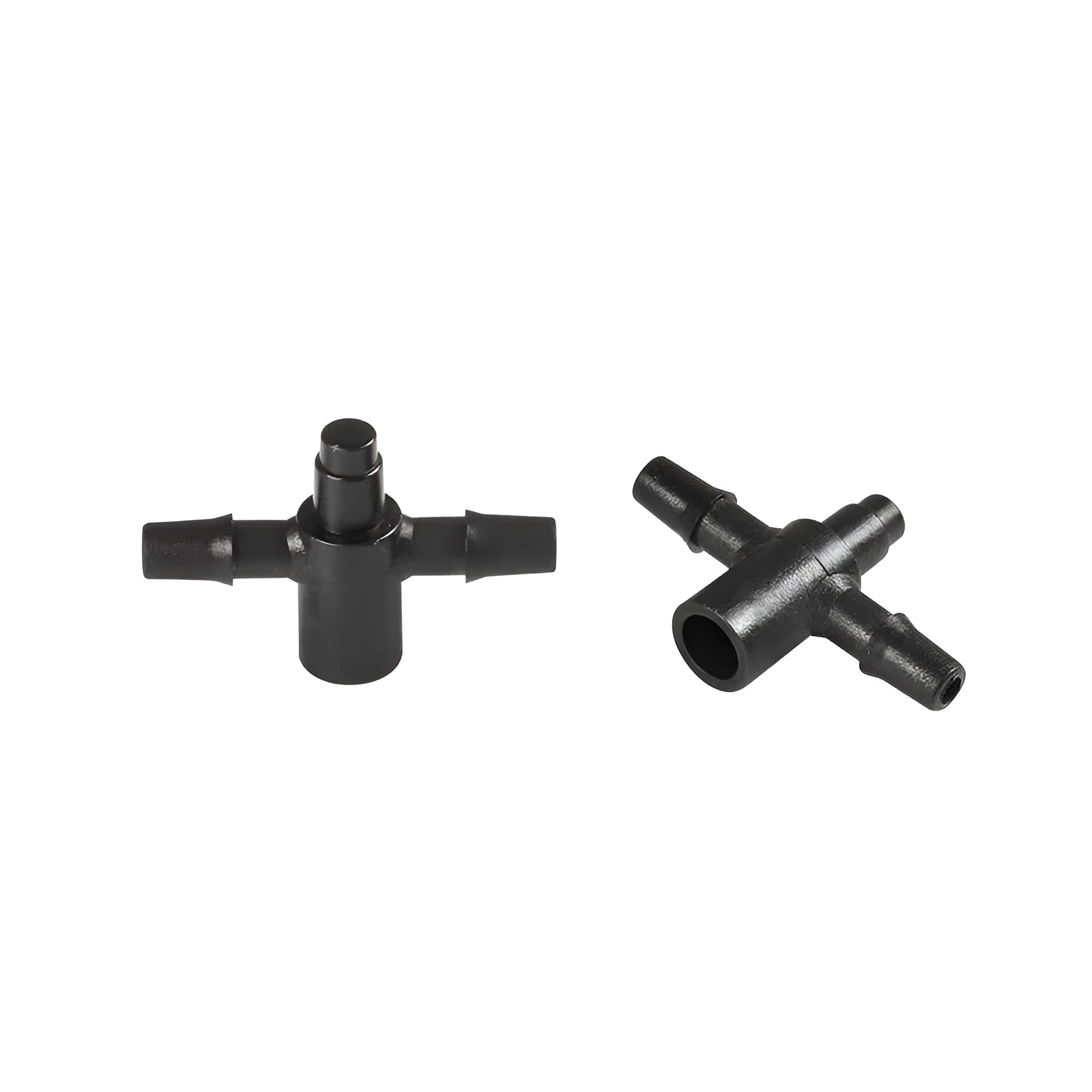 Close-up of a black plastic tee joint water distributor for garden irrigation with three screw-thread outlets.
