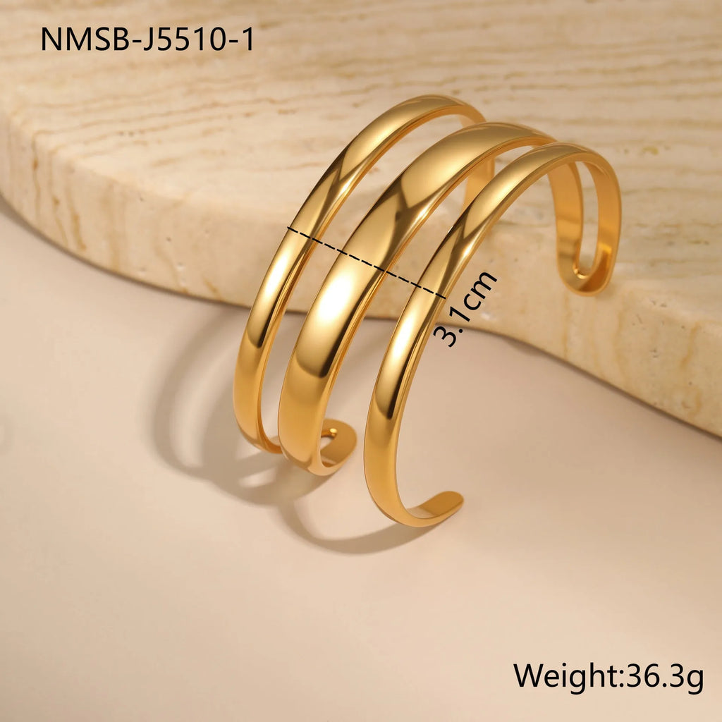 Stainless steel simple opening bracelet with geometric line design in gold or steel electroplated finish