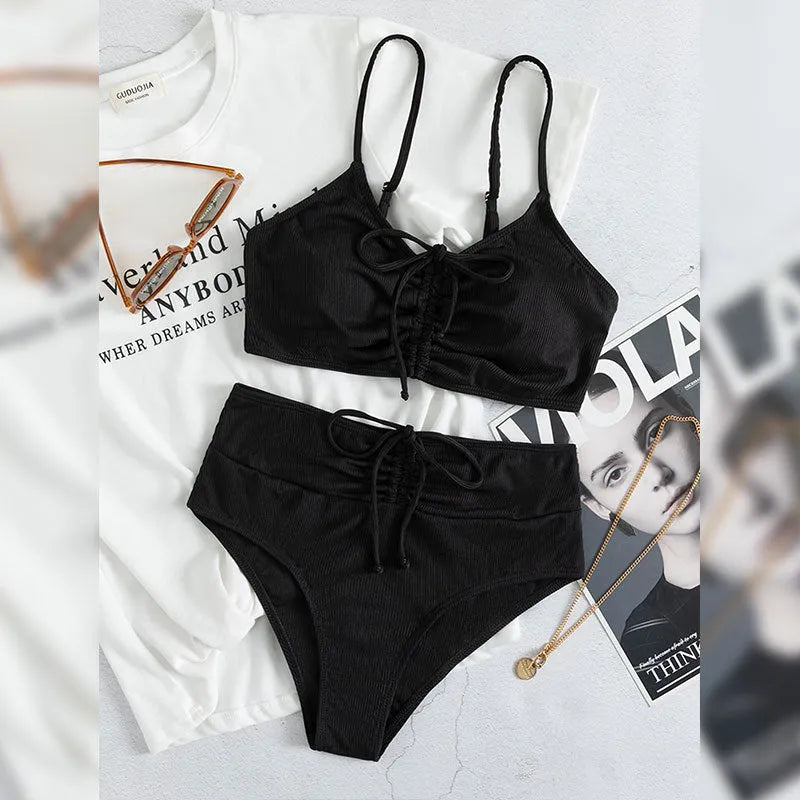 Black women's high waist bikini swimsuit with sling split design showing front view