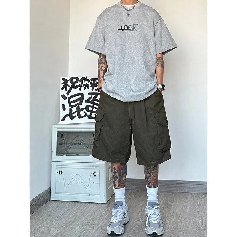 Loose straight-leg casual shorts in black, made from polyester fibre with micro elasticity, shown in a sports style fit