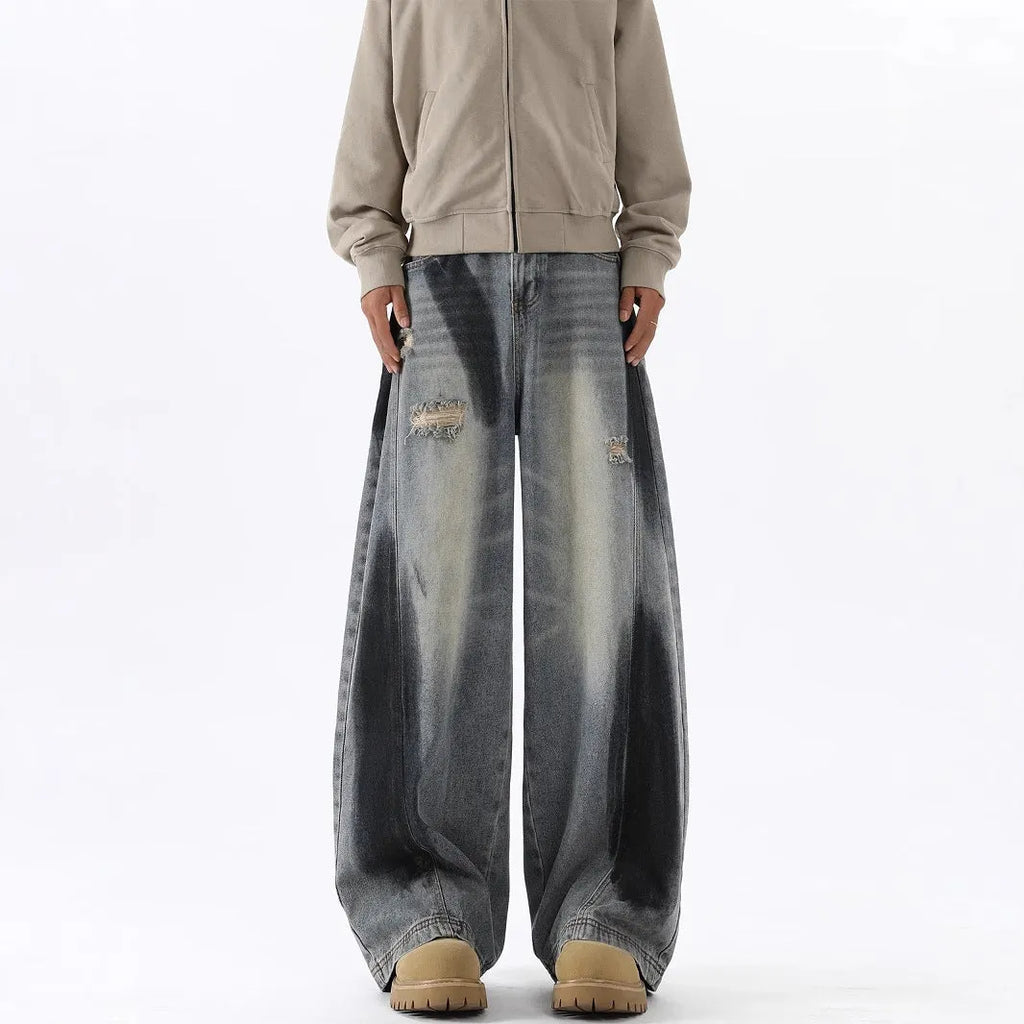 Men's blue loose fit ripped jeans with American-style splash-ink wash and distressed detailing