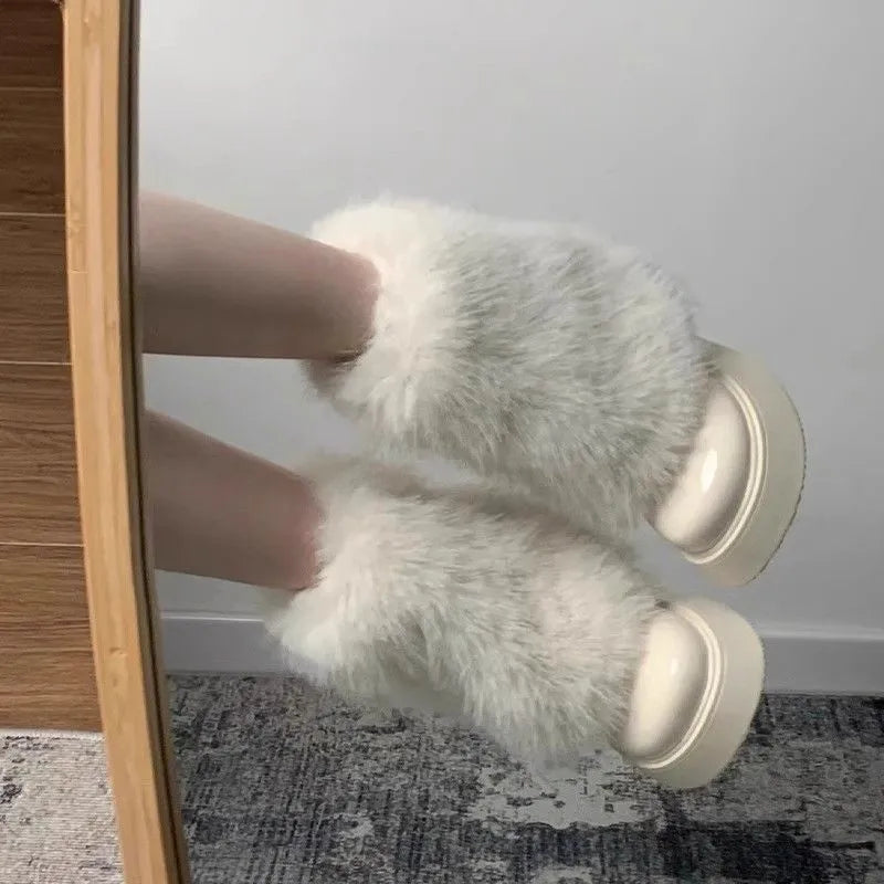 Women's low-top snow boots with artificial plush exterior and waterproof rubber sole in black colour