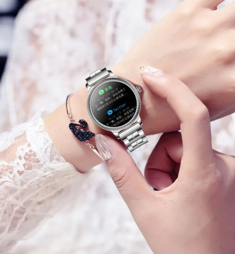 AK38 ladies smart watch with stainless steel band showing 1.09-inch display showing time and notifications