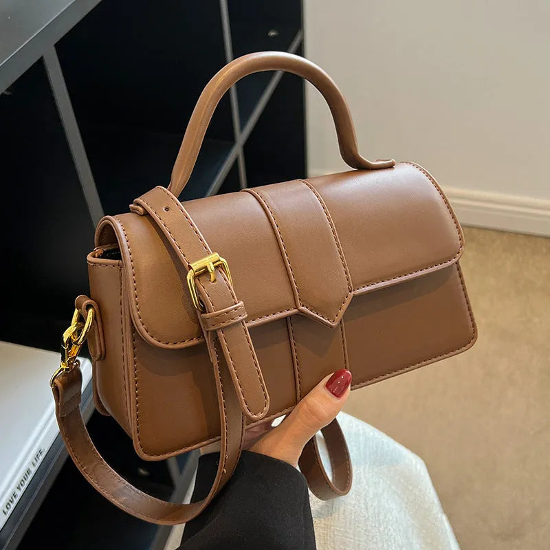 Women's beige messenger bag with 22cm width showing file compartment and exterior pocket
