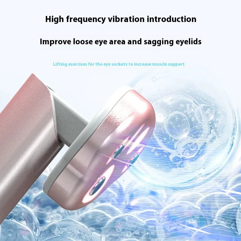 Gradient pink Cat's Paw shape micro-current eye massager with colour light therapy on a white background.