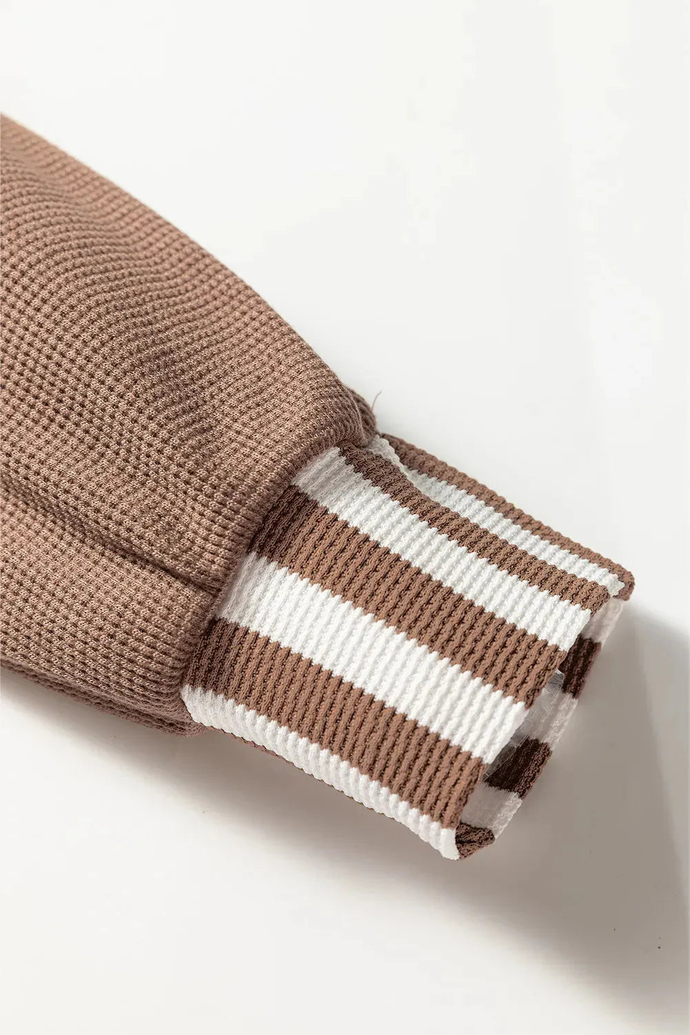 Straw yellow hoodie with waffle texture, striped patchwork design, button neck, and drawstring hood in sizes S M L XL