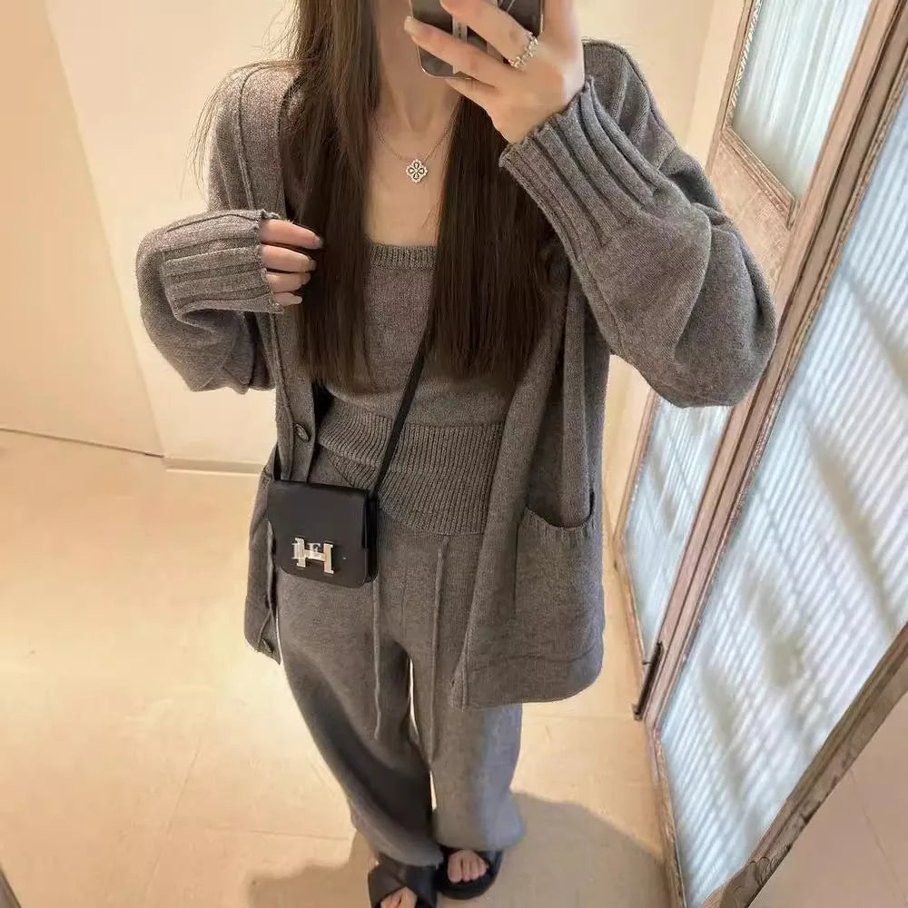 Women's wool blend knit three-piece set showing vest, cardigan coat, and pants in loose fit with seamless construction