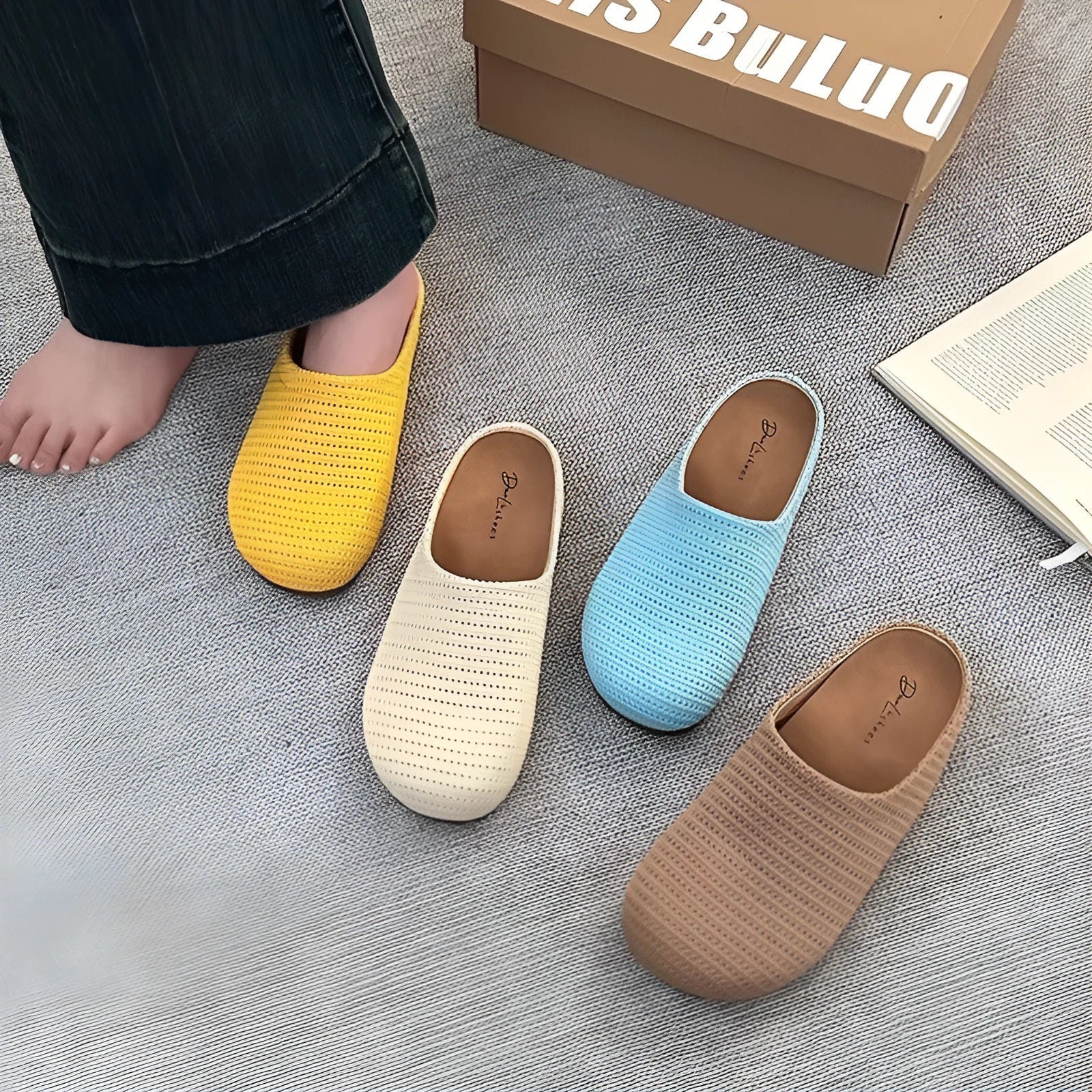 Women's blue cloth slippers with non-slip rubber soles and round toe design shown from side view