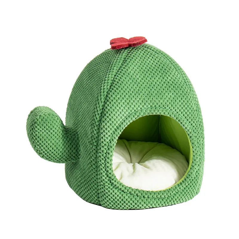Green cactus-shaped enclosed cat bed with soft fluffy fabric and a plush interior for pets.