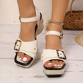 White women's sandals with a metal buckle strap and chunky block heel on a square toe.