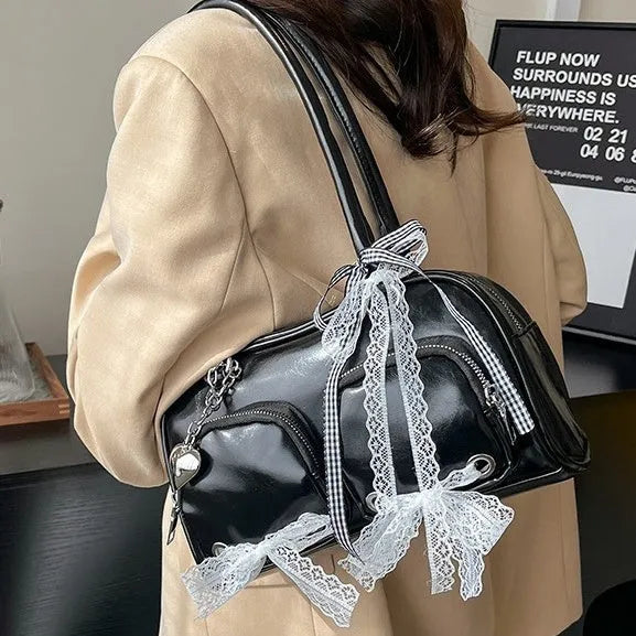 Beige PU shoulder bag with double straps and sewing thread detailing, showing horizontal square shape