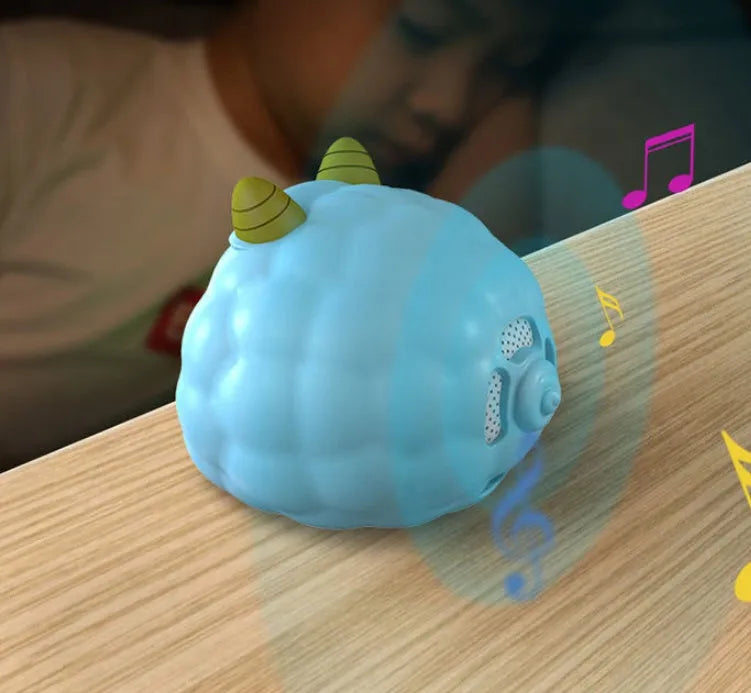White Deer style smart alarm clock with digital display, silicone shell, and power cord.