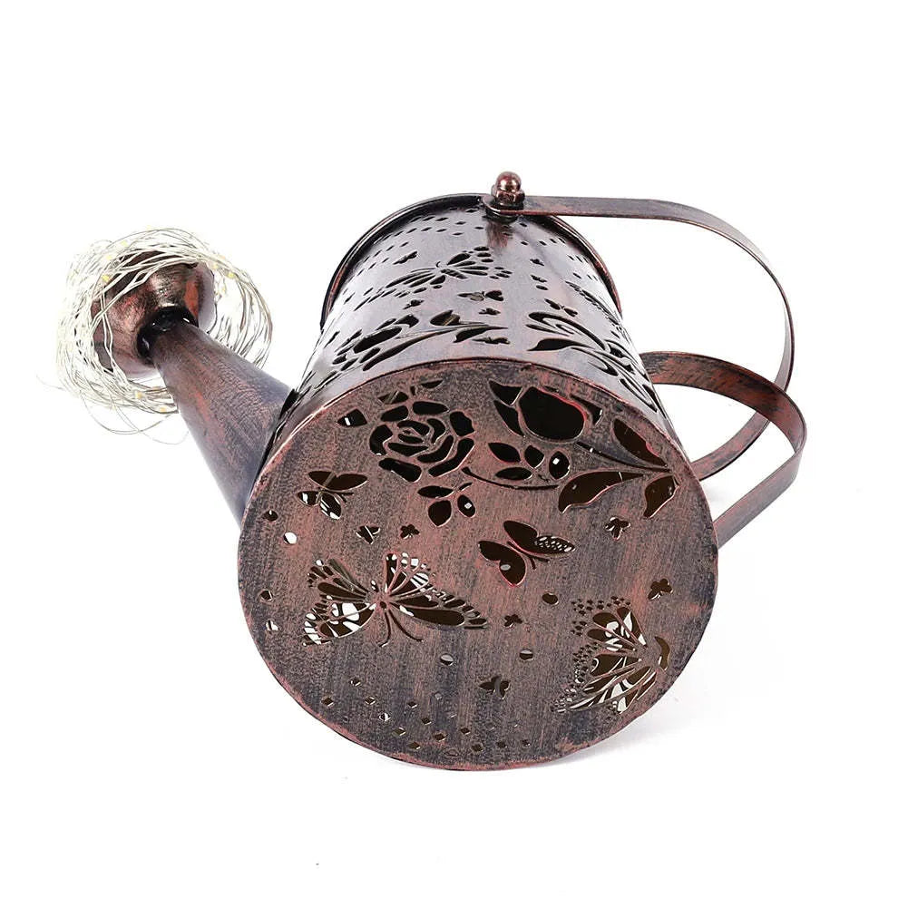 Solar-powered iron garden lamp with tapered butterfly design and warm white LED illumination