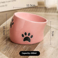 Ceramic cat bowl with high foot design and cat's paw pattern in choice of colours