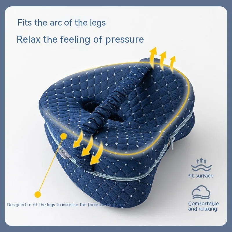 Heart-shaped memory foam leg pillow in dark blue jacquard, measuring 25x23x13cm, for adult leg support