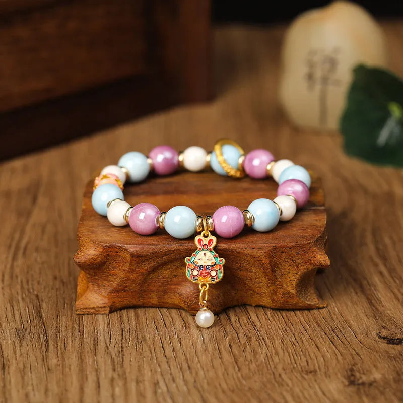Handmade fragrant grey ceramic adjustable bracelet with lucky rabbit charm.
