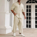 Men's apricot coloured cotton linen casual short-sleeved shirt and matching trousers laid flat.