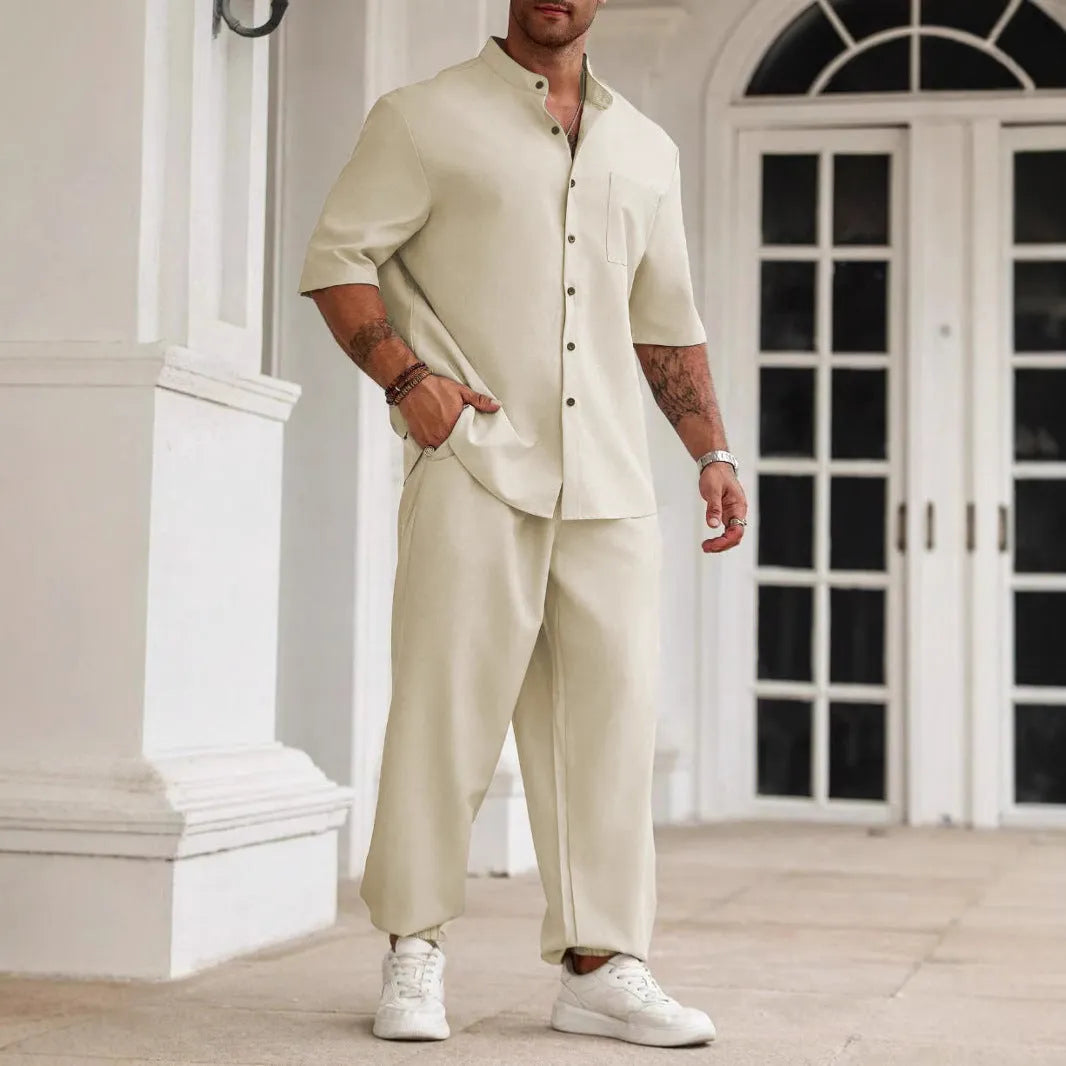 Men's apricot coloured cotton linen casual short-sleeved shirt and matching trousers laid flat.