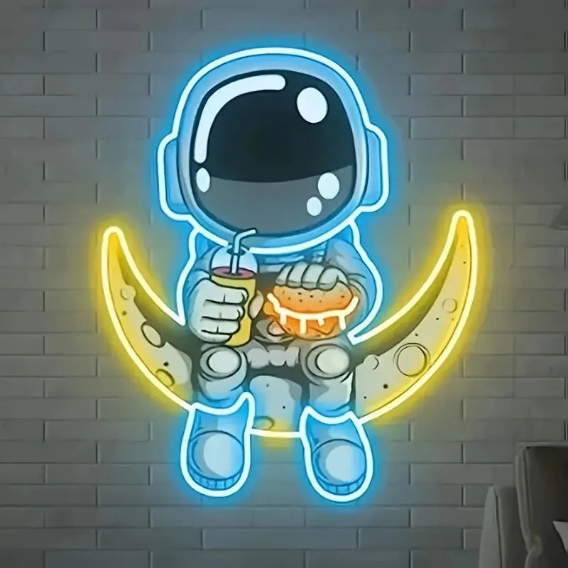 Astronaut-shaped LED neon wall light with moon background, measuring 30 cm by 35 cm.