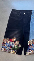 Blue men's cotton shorts with a Jesus design on the back pocket, showing tapered leg.