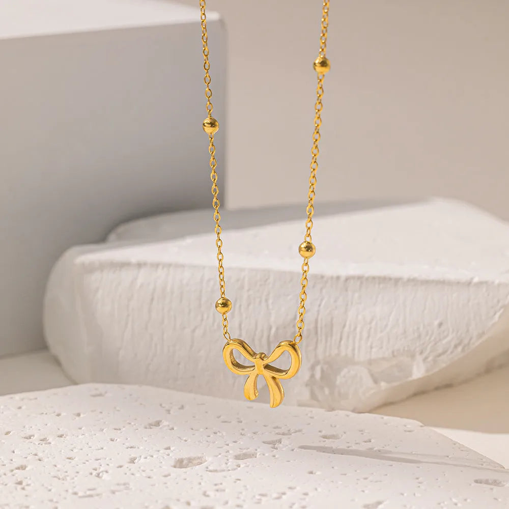 Gold bow necklace with adjustable 41-50cm titanium steel cross chain, European fashion design