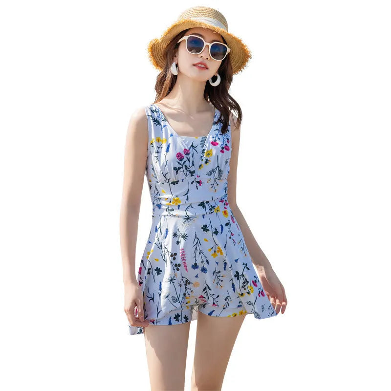 Light purple floral print one-piece swimsuit for women on a hanger.