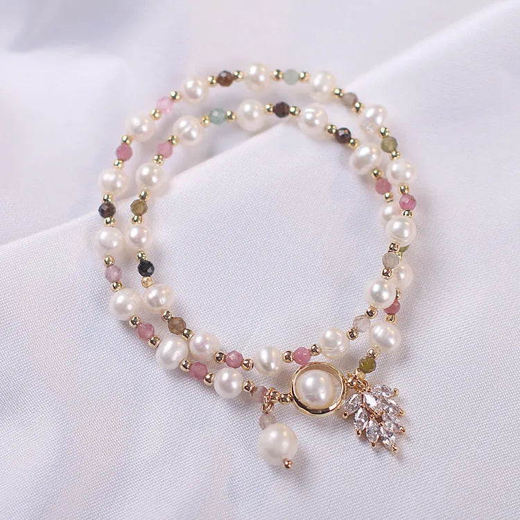 Women's double layer strawberry quartz bracelet with lucky cat charms in red cat's eye flowers colour