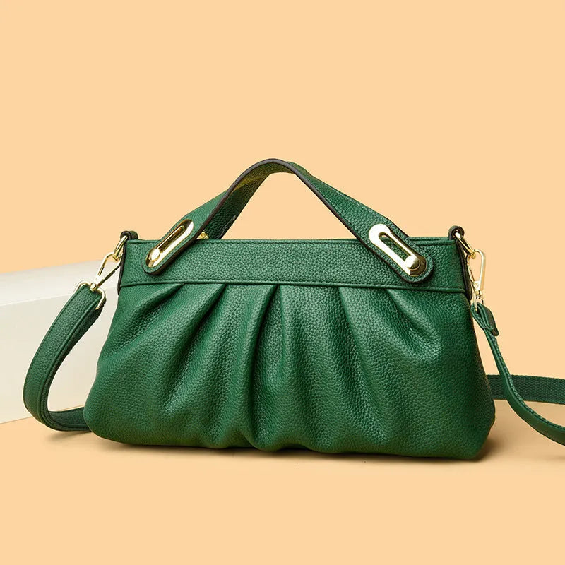 Leather niche pleated shoulder crossbody bag in black with horizontal square shape, multiple interior pockets and soft composite leather.