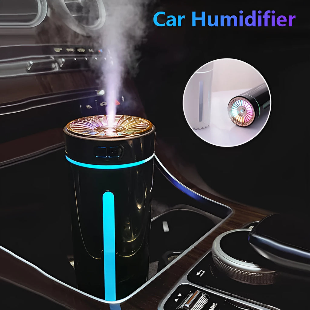 Black portable USB rechargeable humidifier with colourful LED lights on a car cup holder.