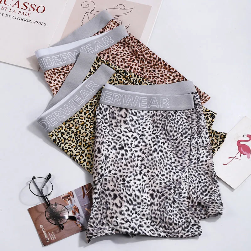 Men's leopard print underwear in milk silk polyester fabric showing loose fit and mid waist design