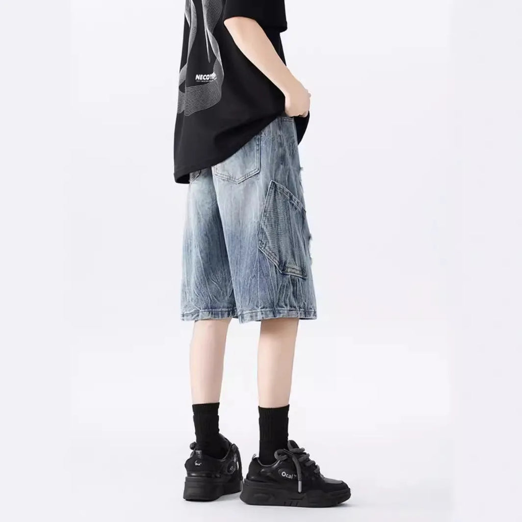 Retro loose-fit ripped denim shorts in washed black or blue with distressed detailing