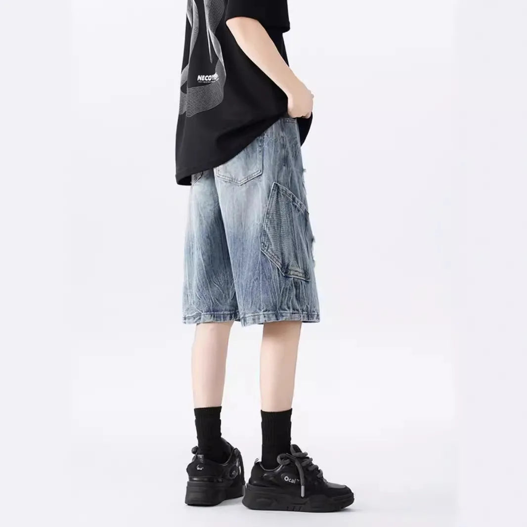 Retro loose-fit ripped denim shorts in washed black or blue with distressed detailing