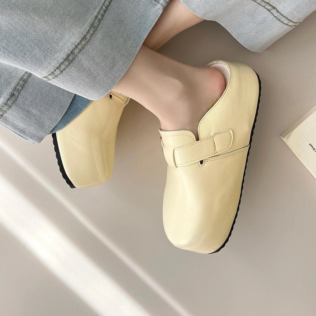 Flat buckle casual sneakers in yellow, creamy-white, silver, and black colours, showing round toe and PU upper.