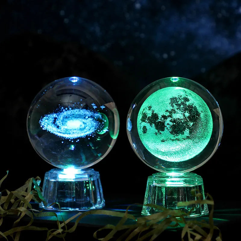 Transparent 6cm white crystal ball ornament with inner carving patterns illuminated by small night lamp on tabletop