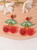 Seven pairs of colourful acrylic fruit and dessert stud earrings on a white background.