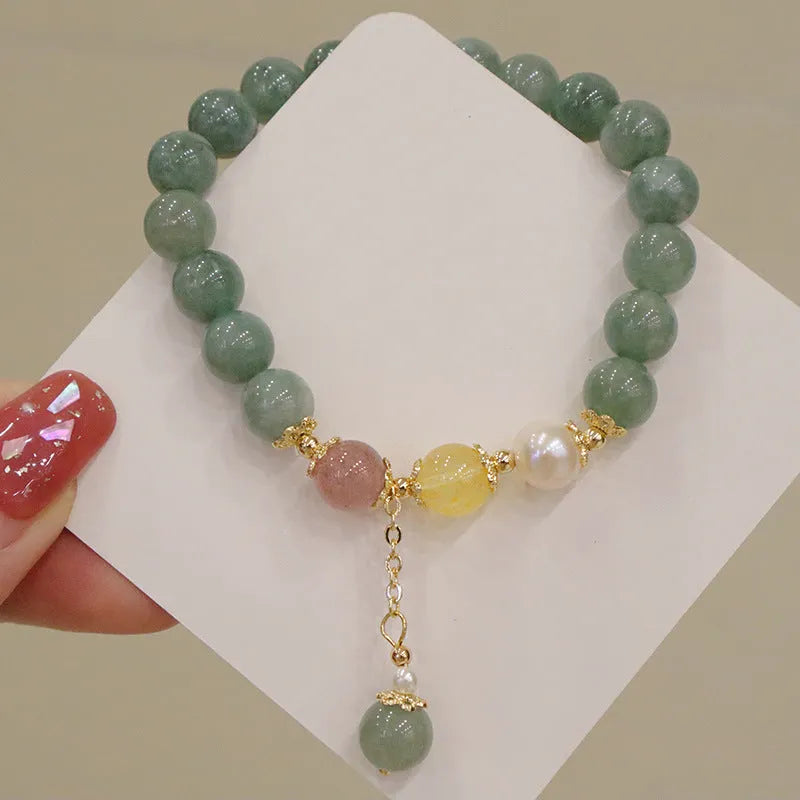 Green Myanmar jade beaded bracelet with pearls and 3D decoration in a geometric Han style design.