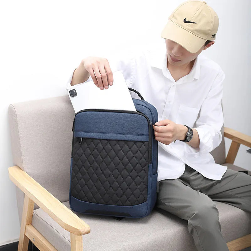 Men's solid colour Oxford cloth travel backpack with diamond mesh panels and curved shoulder straps.