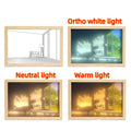 Modern rectangular acrylic LED light painting showing a serene landscape scene, illuminated from behind on a bedside table.