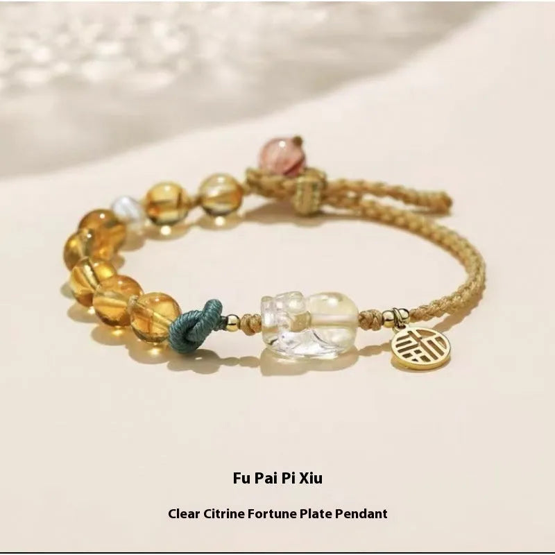 Hand-woven crystal bracelet with animal zodiac design in citrine colour