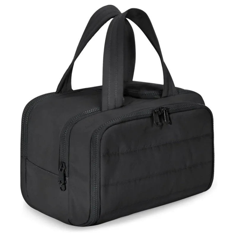 Travel toiletry bag in black with wide-open design showing interior space, dimensions 29.97x18.54x21.08cm