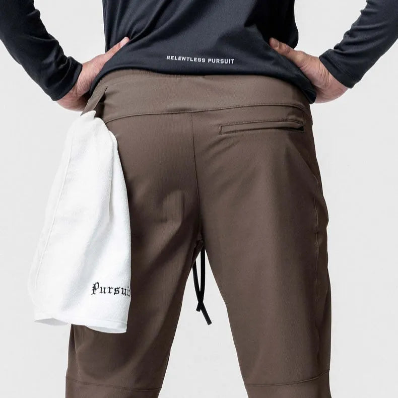 Men's grey fitness trousers with ankle-tied design, quick-drying polyester fabric for exercise