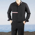 Man's loose-fit Hong Kong style cardigan shirt in a cotton blend fabric, shown in light blue.