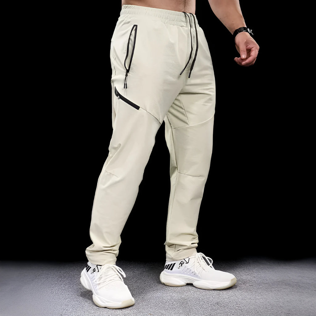 Men's waterproof quick-dry nylon workout trousers in multiple colours for sports and fitness activities