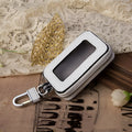 White genuine leather car key case with square vertical design and plain weave texture