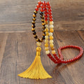 Long beaded bohemian necklace with 108 gemstone tassel pendants on a ball chain.